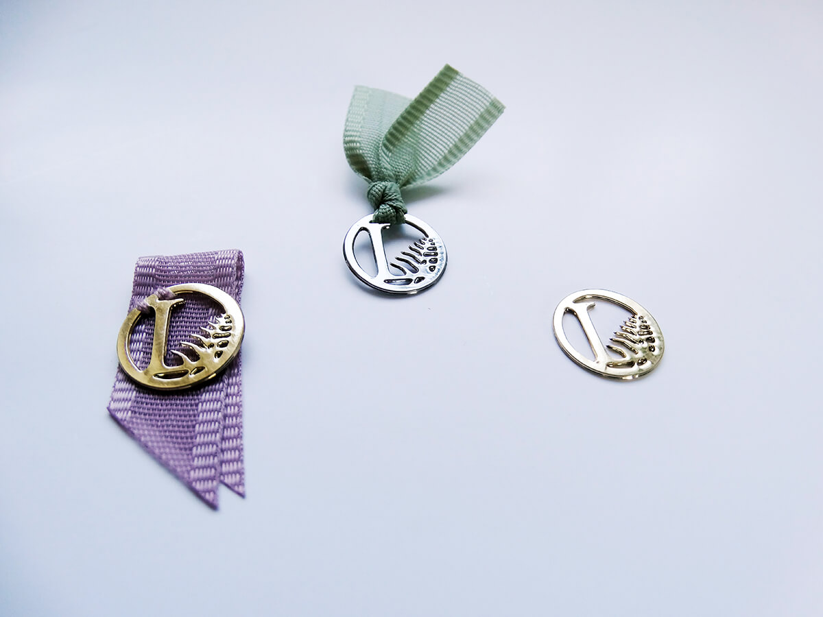 Voile ribbon and engraved charm